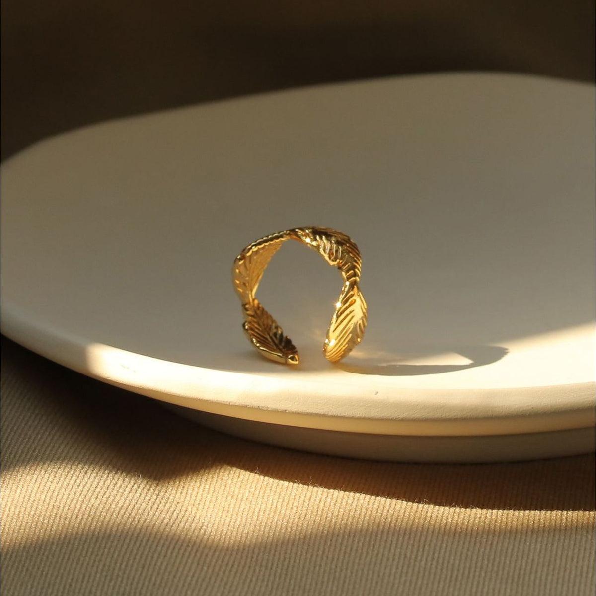 ALODIA LEAVES RING IN BRASS WITH 18K GOLD FINISH