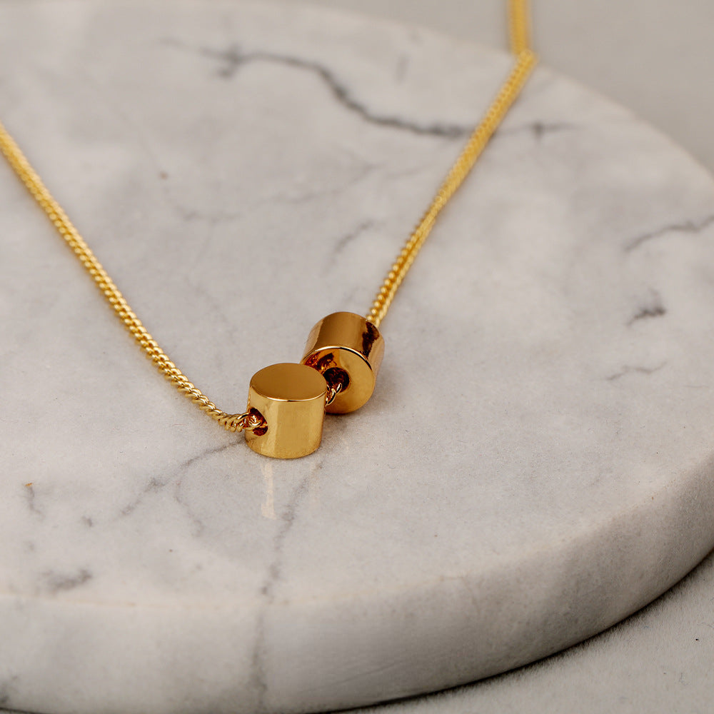 ALODIA  THE CUTE CYLINDER CHIC NECKLACE IN BRASS WITH 18K GOLD FINISH